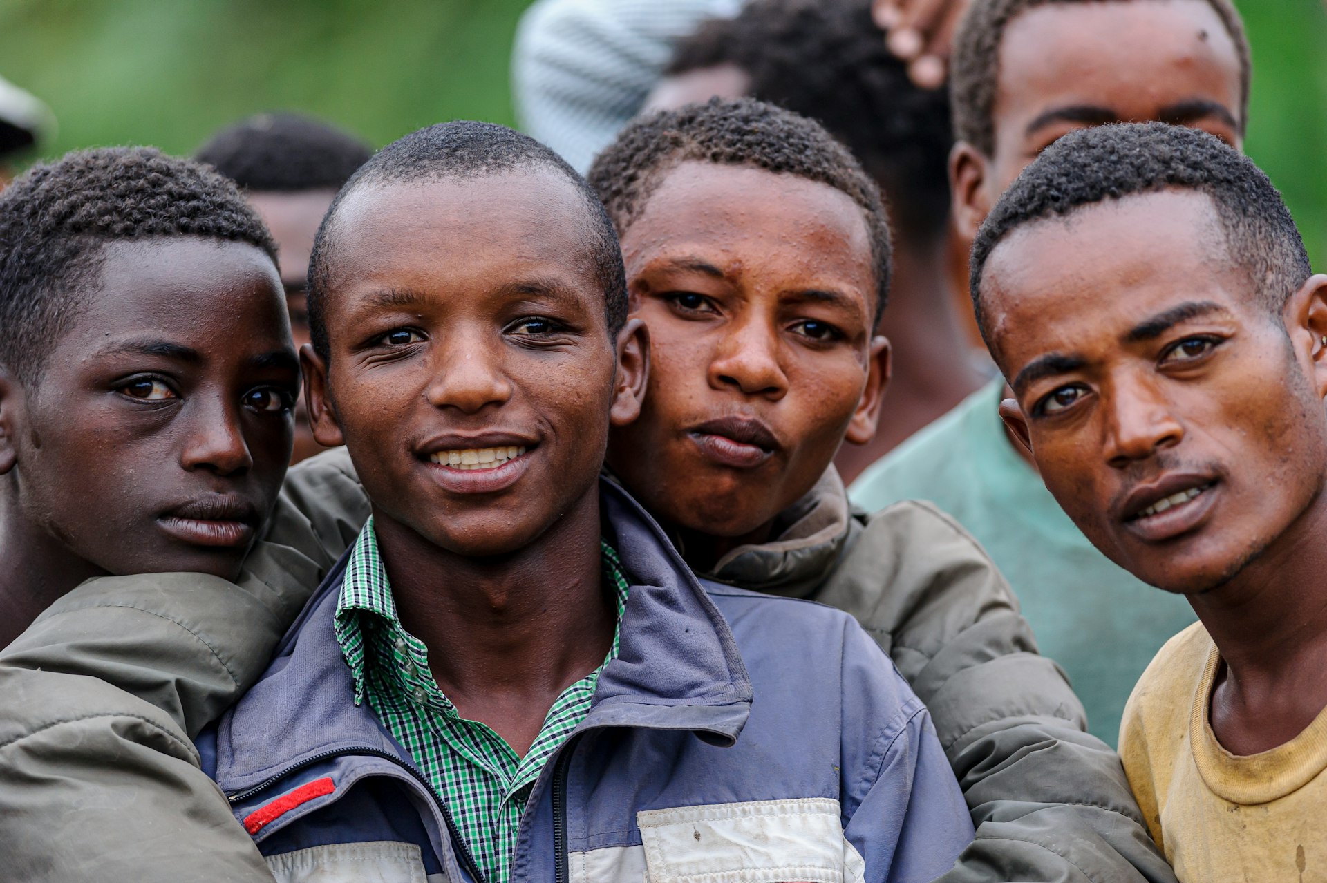 a group of young men standing next to each other